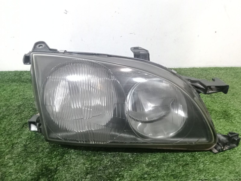 Recambio de faro derecho para toyota avensis (_t22_) 1.6 (at220_) referencia OEM IAM 54533365  FONDO.NEGRO